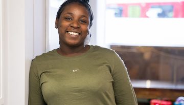 Young black woman smiling at the camera