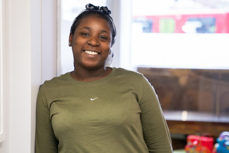 Young black woman smiling at the camera