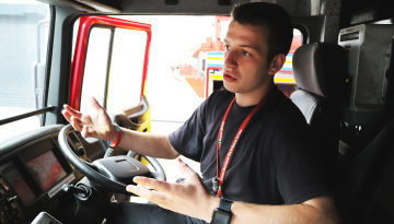 Callum at the wheel in a fire engine