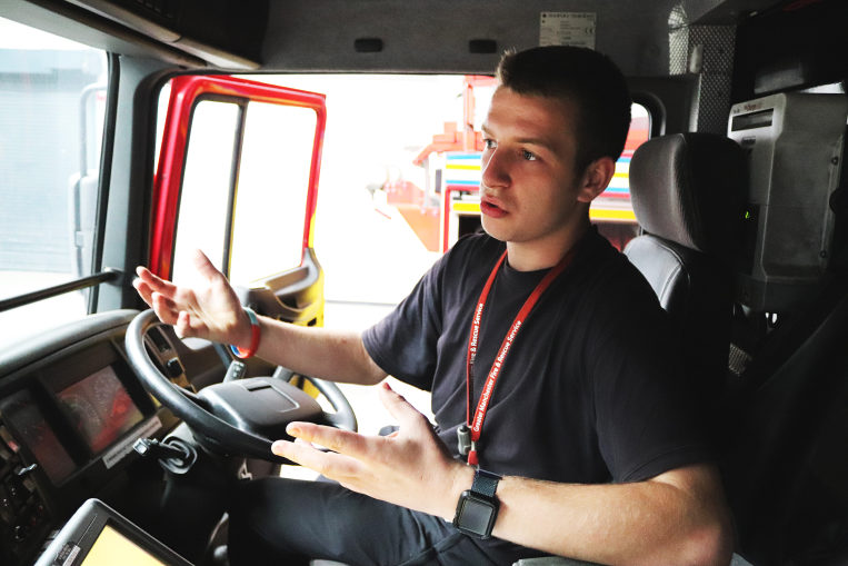 Callum at the wheel in a fire engine