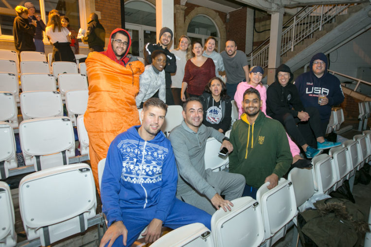 Group of people smiling to camera dressed in casual clothes