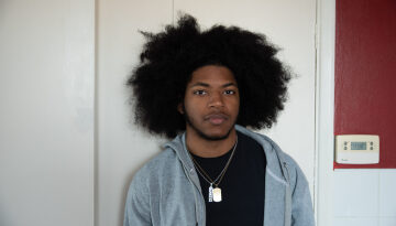 Young man stood in a kitchen