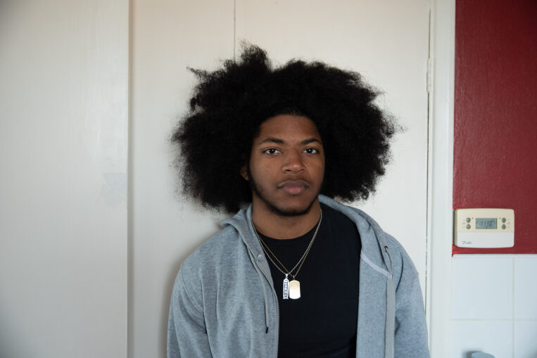 Young man stood in a kitchen