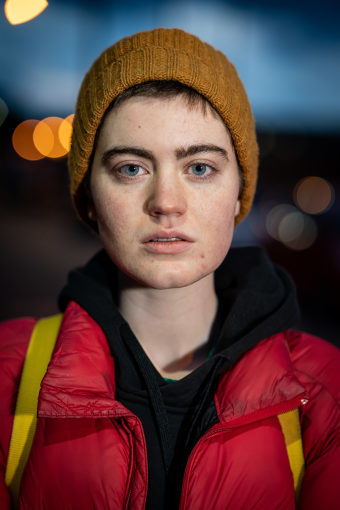 Head and shoulders image of Jo in a red hat and yellow hat.