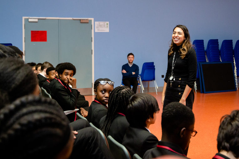 Depaul staff and pupils in a school hall