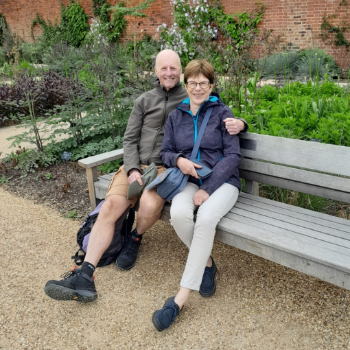 Lindsay and David sitting on a bench in a park