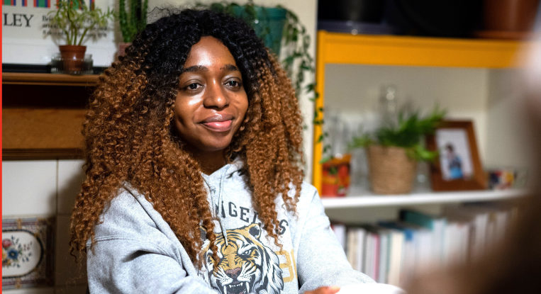 Young person smiling to camera