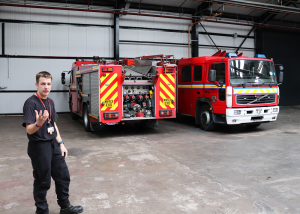 Callum at fire station with fire engines