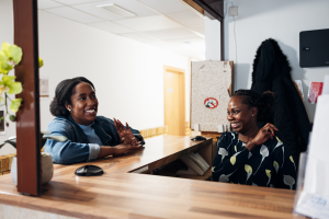Young woman talking to Depaul UK staff