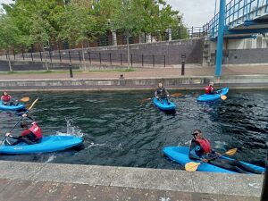 A group of people in kayaks