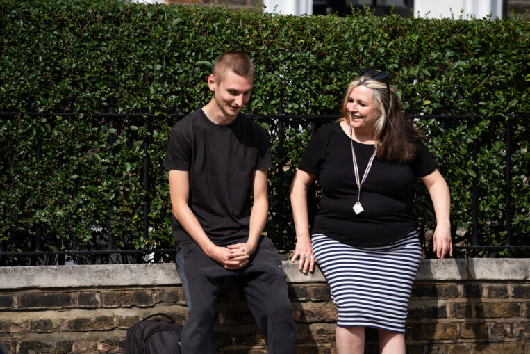 staff member and young person chatting