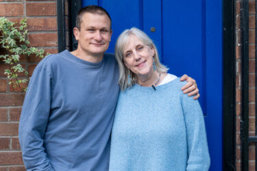Janice and John stood outside their front door