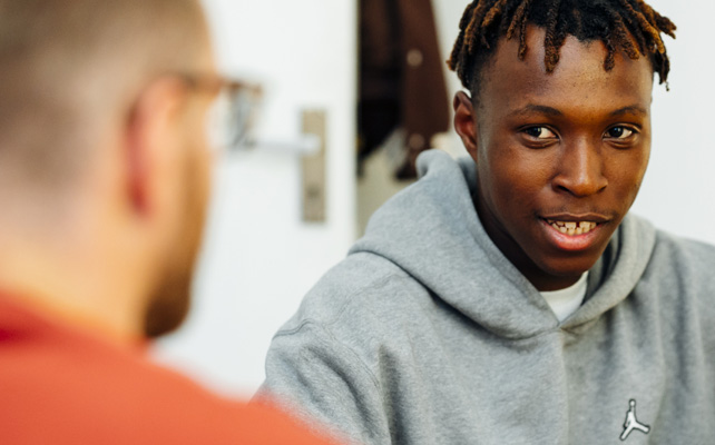 Young person talking to host