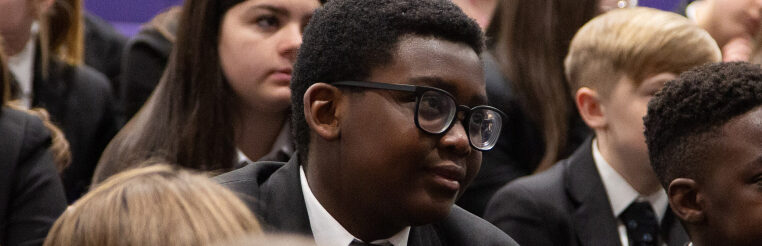 Image of young boy in an assembly