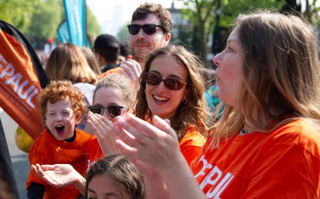woman clapping at marathon event