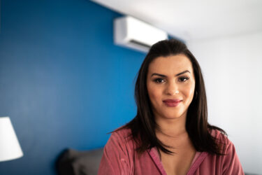 Portrait of a young transgender woman at home